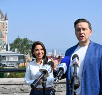 Conservative Leader Pierre Poilievre speaks duringa news conference as his wife Anaida looks on, in Quebec City, Wednesday, Sept. 6, 2023. Jacques Boissinot/The Canadian Press. 