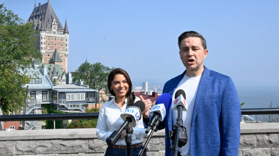 Conservative Leader Pierre Poilievre speaks duringa news conference as his wife Anaida looks on, in Quebec City, Wednesday, Sept. 6, 2023. Jacques Boissinot/The Canadian Press. 