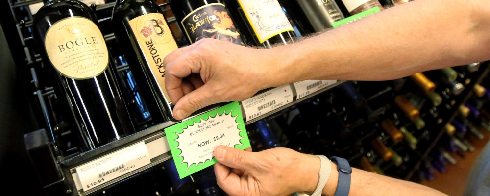 A worker at a state liquor store changes prices on wine, liquor and higher-alcohol beer, after closing to the public Friday, June 30, 2017, Salt Lake City. Rick Bowmer/AP Photo. 