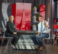 Liberal leader Justin Trudeau waves to the audience as he sits down with host Rosie Barton for a recording of CBC Face to Face Townhall, Monday, September 30, 2019  in Toronto. Ryan Remiorz/The Canadian Press. 