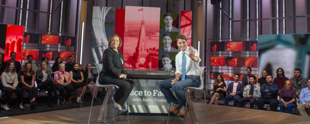 Liberal leader Justin Trudeau waves to the audience as he sits down with host Rosie Barton for a recording of CBC Face to Face Townhall, Monday, September 30, 2019  in Toronto. Ryan Remiorz/The Canadian Press. 