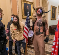 Supporters of President Donald Trump are confronted by Capitol Police officers outside the Senate Chamber inside the Capitol, Wednesday, Jan. 6, 2021 in Washington. Manuel Balce Ceneta/AP Photo. 