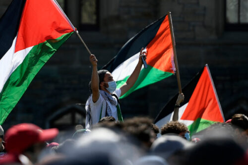 People rally on Parliament Hill in Ottawa on Sunday May 23, 2021. Justin Tang/The Canadian Press. 