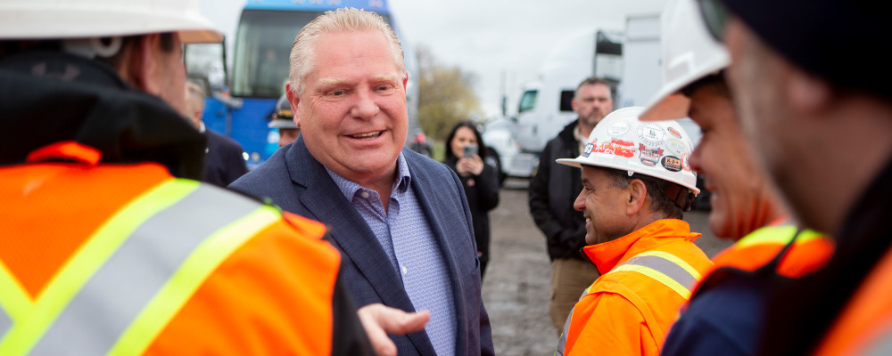 Ontario Premier Doug Ford greets workers at a construction site in Brampton, Ont. on Wednesday, May 4, 2022. Chris Young/The Canadian Press. 