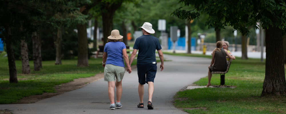 People are seen in the Ottawa neighbourhood of Westboro on Sunday, July 24, 2022. Spencer Colby/The Canadian Press. 