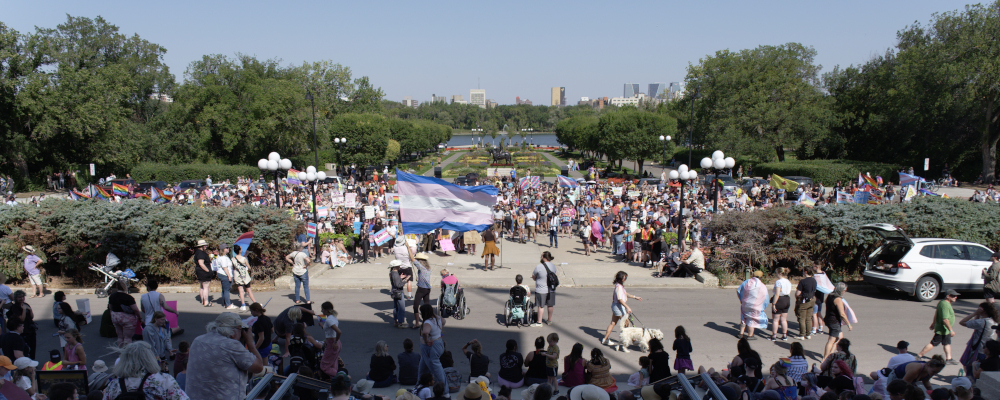 People protest in Regina on Sept. 2, 2023. Michael Bell/The Canadian Press.