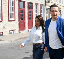Conservative Leader Pierre Poilievre and his wife Anaida walk from a news conference in Quebec City, Wednesday, Sept. 6, 2023. Jacques Boissinot/The Canadian Press. 