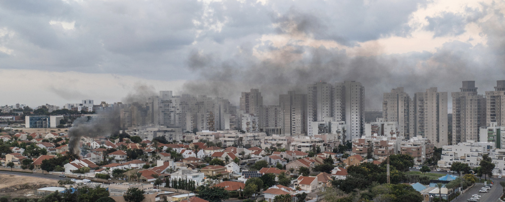 Smoke rises after a rocket fired from the Gaza Strip hit a house in Ashkelon, southern Israel, Saturday, Oct. 7, 2023. Tsafrir Abayov/AP Photo.