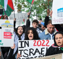 People take part in a protest for Palestine in Montreal, Sunday, October 8, 2023. Hamas militants led a surprise attack on Israel from the Gaza Strip on Saturday leading to many casualties on both sides and retaliation strikes by Israel into Gaza. Graham Hughes/The Canadian Press.