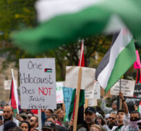 Protestors attend a march in support of Palestine through downtown Hamilton, Ont. on Sunday, October 15, 2023. Peter Power/The Canadian Press.