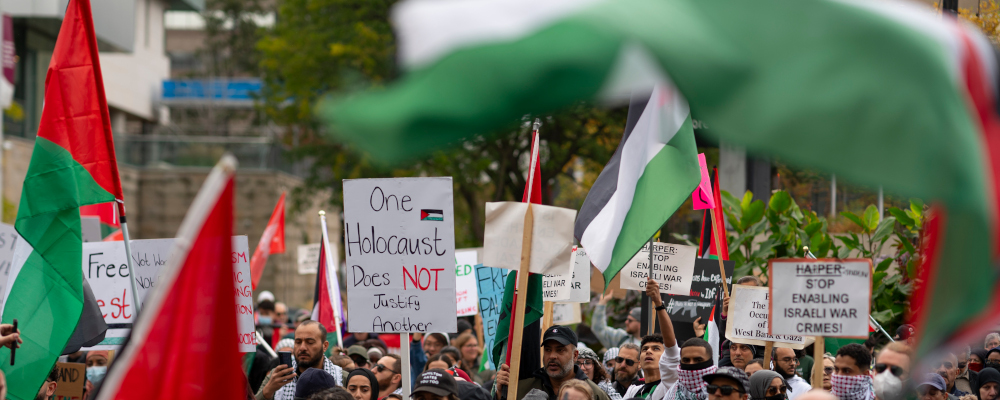 Protestors attend a march in support of Palestine through downtown Hamilton, Ont. on Sunday, October 15, 2023. Peter Power/The Canadian Press.