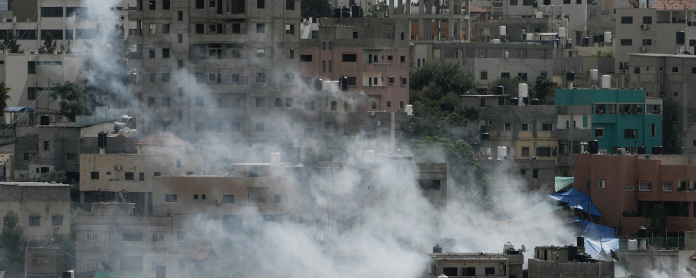 Smoke rises during an Israeli military raid on Nur Shams, West Bank, on Thursday, Oct. 19, 2023. Majdi Mohammed/AP Photo.