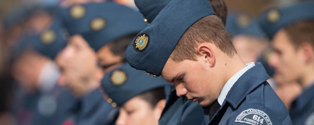 An air cadet bows his head in prayer during Remembrance Day ceremony at the Cenotaph in London Ontario, Sunday, November 11, 2012. Geoff Robins/The Canadian Press. 