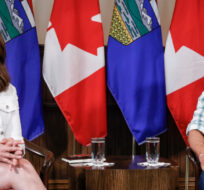Prime Minister Justin Trudeau, right, meets with Alberta Premier Danielle Smith in Calgary, Alta., Friday, July 7, 2023. Jeff McIntosh/The Canadian Press. 