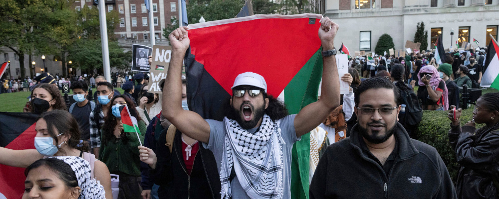 Palestinian supporters chant as they march during a protest at Columbia University, Thursday, Oct. 12, 2023, in New York. Yuki Iwamura/AP Photo. 