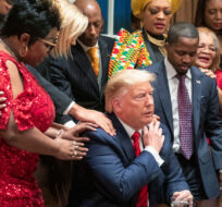 African American leaders say a prayer with President Donald Trump as they end a meeting in the Cabinet Room of the White House, Thursday, Feb. 27, 2020, in Washington. Manuel Balce Ceneta/AP Photo. 