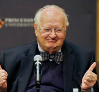 Angus Deaton gestures at a gathering at Princeton University after it was announced that he won the Nobel prize in economics for improving understanding of poverty and how people in poor countries respond to changes in economic policy Monday, Oct. 12, 2015. Mel Evans/AP Photo.
