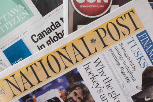 Postmedia newspapers, including the National Post and Ottawa Citizen, are shown with Quebecor Media's Ottawa Sun on Monday, Oct. 6, 2014. Justin Tang/The Canadian Press.