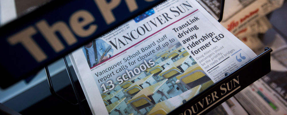 Copies of Postmedia-owned newspapers the Vancouver Sun and The Province are displayed at a store in Burnaby, B.C., on Tuesday January 19, 2016. Darryl Dyck/The Canadian Press. 