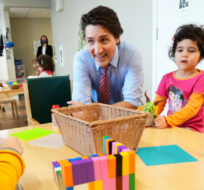 Prime Minister Justin Trudeau sits with children at a local child care centre in Ottawa, Wednesday, March 29, 2023. Sean Kilpatrick/The Canadian Press. 