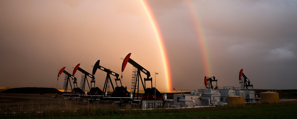 A rainbow appears to come down on pumpjacks drawing out oil and gas from wells near Calgary, Alta., Monday, Sept. 18, 2023. Jeff McIntosh/The Canadian Press.