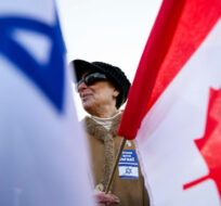 People gather following a demonstration in support of Israel and the release of hostages, in Toronto, Sunday, Nov. 12, 2023. Christopher Katsarov/The Canadian Press. 