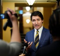 Prime Minister Justin Trudeau speaks to reporters in the foyer of the House of Commons on Parliament Hill in Ottawa on Wednesday, Dec. 13, 2023. Sean Kilpatrick/The Canadian Press.