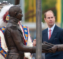 Prince Edward, Earl of Wessex, looks at a sculpture to commemorate the First Nations' contribution to the War of 1812, near the Saskatoon Farmers' Market in Saskatoon, Friday, September 19, 2014. Liam Richards/The Canadian Press. 