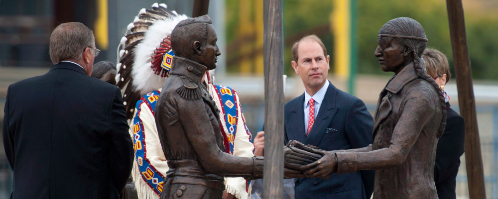 Prince Edward, Earl of Wessex, looks at a sculpture to commemorate the First Nations' contribution to the War of 1812, near the Saskatoon Farmers' Market in Saskatoon, Friday, September 19, 2014. Liam Richards/The Canadian Press. 