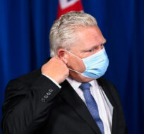 Ontario Premier Doug Ford arrives for a press conference during the COVID-19 pandemic in Toronto, Friday, November 20, 2020. Nathan Denette/The Canadian Press. 