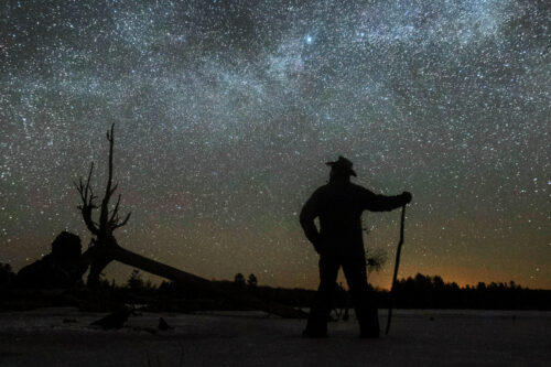Stargazer Dave Cooke observes an unusual placement of the Milky Way, over a frozen fish sanctuary in central Ontario, north of Hwy 36 in Kawartha Lakes, Ont., on Sunday, March 21, 2021. For a few days twice during the year, the Milky Way Galaxy can be seen stretched laterally across the sky at, approximately 3.00 am. THE CANADIAN PRESS/Fred Thornhill