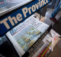 Copies of Postmedia-owned newspapers the Vancouver Sun, Province and National Post are displayed at a store in Burnaby, B.C., on Tuesday January 19, 2016. Darryl Dyck/The Canadian Press. 