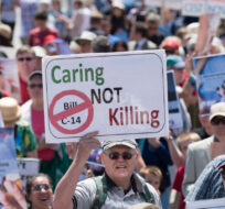 People rally against Bill C-14, the medically assisted dying bill in Ottawa. Justin Tang/The Canadian Press.