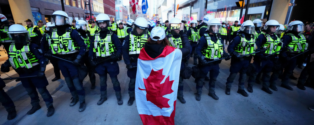 A protester confronts police during a demonstration, part of a convoy-style protest participants are calling "Rolling Thunder", in Ottawa, Friday, April 29, 2022. Sean Kilpatrick/The Canadian Press. 
