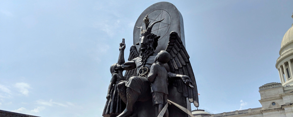 The Satanic Temple unveils its statue of Baphomet, a winged-goat creature, at a rally for the first amendment in Little Rock, Ark., Thursday, Aug. 16, 2018. Hannah Grabenstein/AP Photo. 