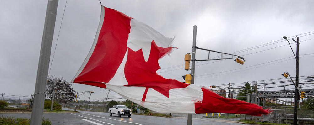 A Canadian flag waves in the high winds in Dartmouth, N.S. on Saturday, Sept. 24, 2022. Andrew Vaughan/The Canadian Press.