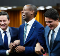 Newly elected Speaker of the House of Commons Greg Fergus is escorted into the House of Commons by Prime Minister Justin Trudeau and Conservative Leader Pierre Poilievre on Parliament Hill in Ottawa on Tuesday, Oct. 3, 2023. Sean Kilpatrick/The Canadian Press. 