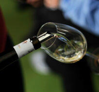A taster pours white wine during a session to promote regional wine, in Pamplona northern Spain on Tuesday, Jan. 29, 2013. Alvaro Barrientos/AP Photo. 