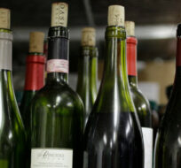 This Thursday, Feb. 24, 2011 photo shows a shelf are bottles of leftover wine that will be used for cooking at the Camino restaurant in Oakland, Calif. Eric Risberg/AP Photo. 