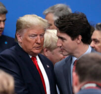 U.S. President Donald Trump, center left, and Canadian Prime Minister Justin Trudeau chat before a round table meeting of NATO leaders in Watford, Hertfordshire, England, Wednesday, Dec. 4, 2019. Evan Vucci/The Canadian Press. 
