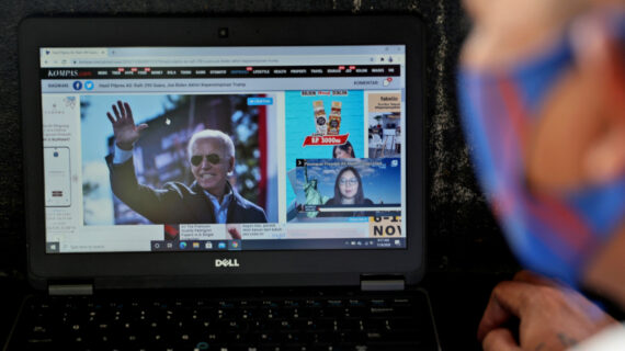 A man reads a news website on his laptop in Jakarta, Indonesia, Sunday, Nov. 8, 2020. Tatan Syuflana/AP Photo. 