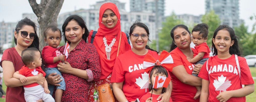 People pose for photos on Canada day in Montreal, Friday, July 1, 2022. Graham Hughes/The Candian Press. 
