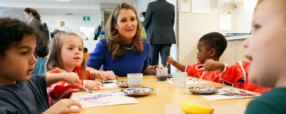 Deputy Prime Minister and Minister of Finance, Chrystia Freeland sits with children at a local child care centre in Ottawa, Wednesday, March 29, 2023. Sean Kilpatrick/The Canadian Press. 