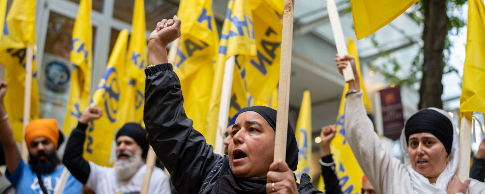 Pro-Punjabi independence protesters chant outside of the Consulate General of India Office in Vancouver, on Saturday, June 24, 2023. Ethan Cairns/The Canadian Press. 
