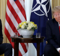 U.S. President Donald Trump grimaces during a meeting with NATO Secretary General, Jens Stoltenberg at Winfield House in London, Tuesday, Dec. 3, 2019. Evan Vucci/AP Photo. 