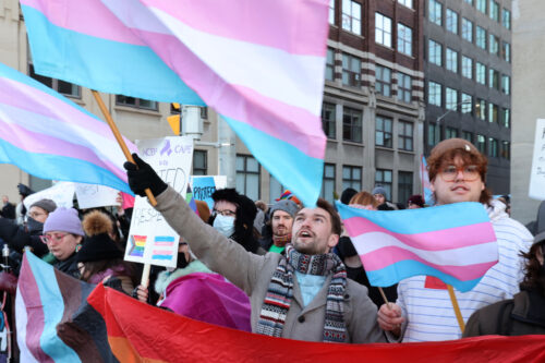 People protest Alberta Premier Danielle Smith's proposed youth transgender policies as she appears at an event in Ottawa on Monday, Feb. 5, 2024. Patrick Doyle/The Canadian Press.