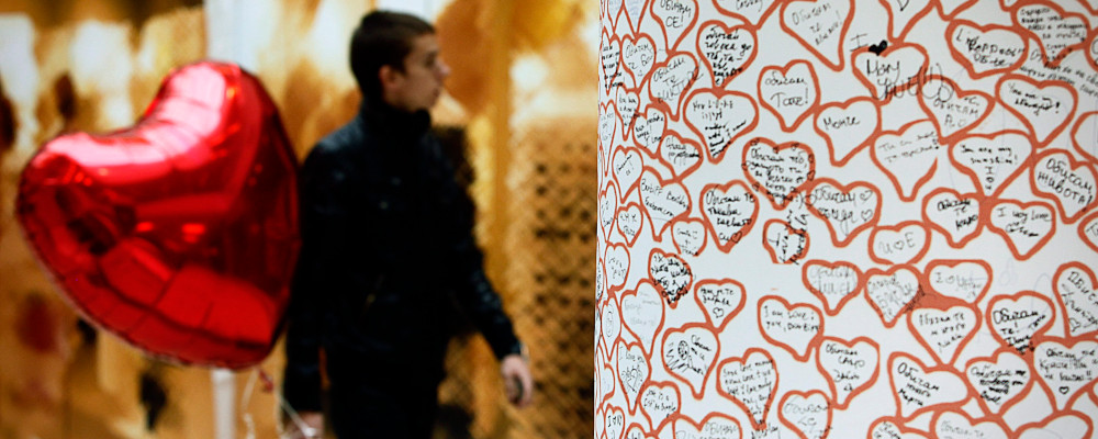 A Bman carries a red heart balloon for Valentine's day in Sofia, Monday, Feb. 14, 2011. Valentina Petrova/AP Photo. 
