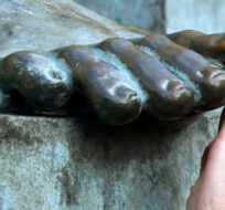  In this Feb. 6, 2007 file photo, an unidentified woman touches the toe of the bronze statue of Scottish philosopher David Hume in Edinburgh, Scotland.  Martin Cleaver/AP Photo. 