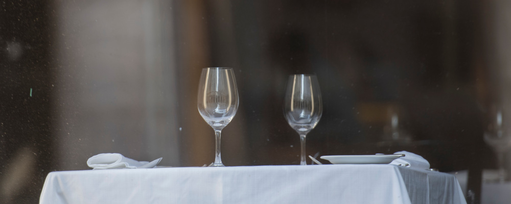 Wine glasses are shown on a dining table in an empty restaurant in Montreal, Saturday, Oct. 10, 2020. Graham Hughes/The Canadian Press. 
