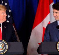 Prime Minister Justin Trudeau, right, and President of the United States Donald Trump participate in a signing ceremony for the new United States-Mexico-Canada Agreement with President of Mexico Enrique Pena Nieto (not shown) in Buenos Aires, Argentina on Friday, Nov. 30, 2018. Sean Kilpatrick/The Canadian Press.